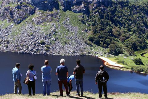 Geoscientists overlooking a lake